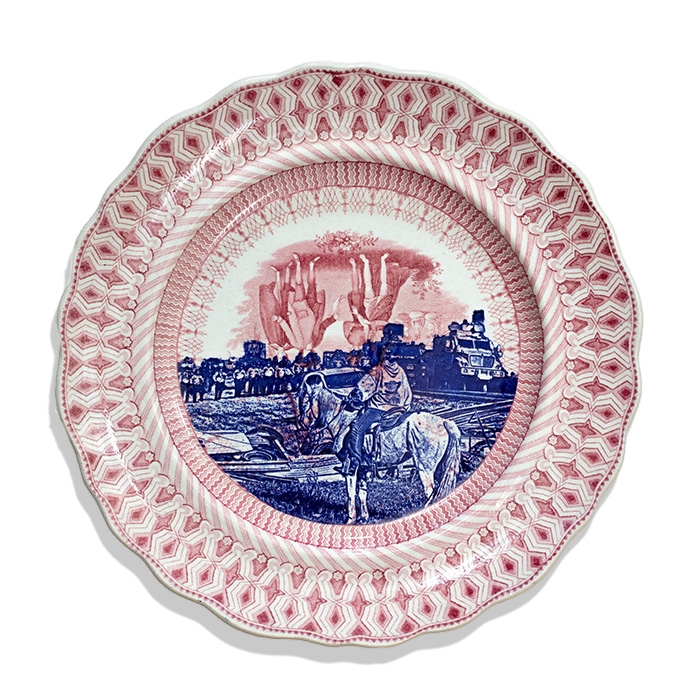 Paul Scott, "Cumbrian Blue(s), New American Scenery, Broken Treaties, Standing Rock, After Ryan Vizzions, with Mega Mae Plenty Chief, Lakota Oyate on horseback, No. 3", 2022, transfer print collage on Wm Penn's Treaty transferware plate by Thomas Goodwin c.1835, 10.5 x 10.5 x 1.25". Red, blue, and white transferware plate, with updated decal imagery of Standing Rock, ND. The imagery is of Mega Mae Plenty Chief, a Lakota Oyate on horseback, posed in front of the police and military present and opposing. They are the single figure if front of the entire army presence, signifying the resistance to drilling for oil in the US on Native American Lands. Subject matter for the artwork includes the following artist series: New American Scenery, Native American, Antique, Energy, Environment, Race, Indigeneity